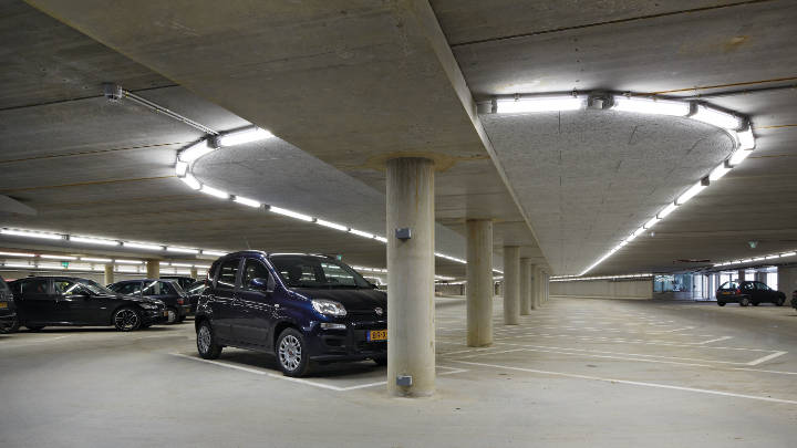 Parking garage and its information desk lit by Philips lighting 